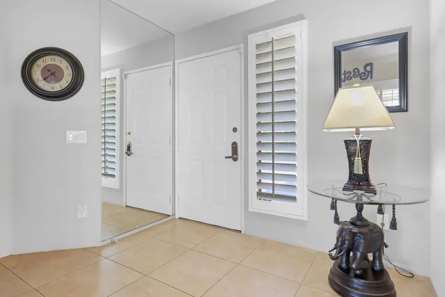 a view of a livingroom with furniture and a window