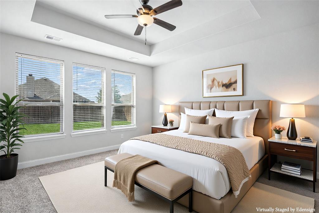 117 Joshua Tree Court Forney, TX 75126 - Photo 14 of 29 a spacious bedroom with a bed and a large window