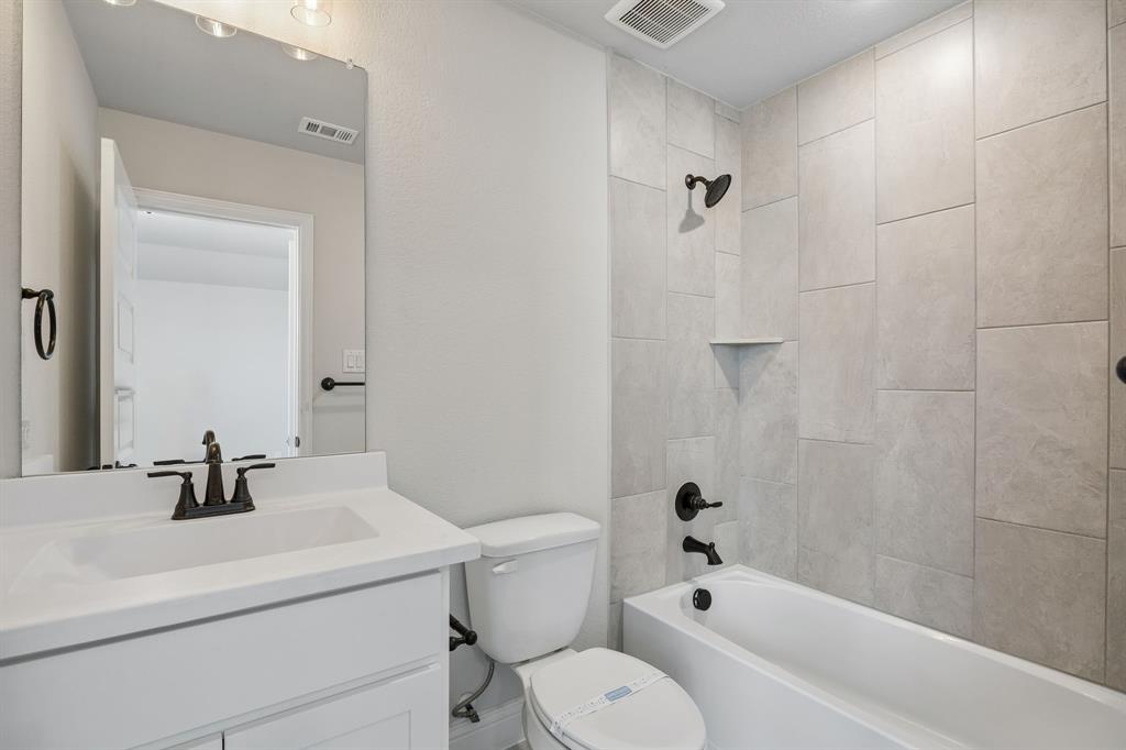 117 Joshua Tree Court Forney, TX 75126 - Photo 23 of 29 a bathroom with a sink a toilet and shower