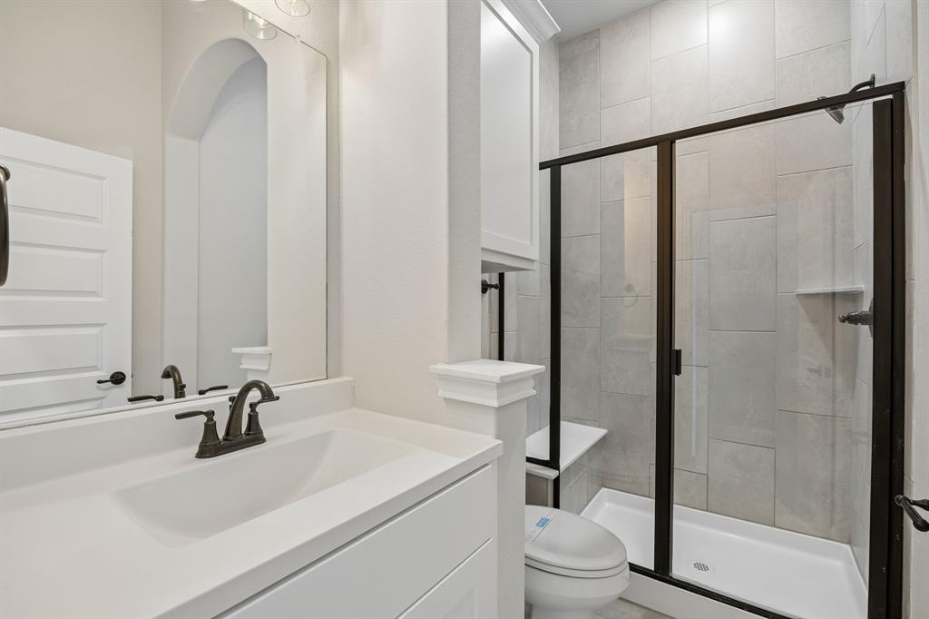 117 Joshua Tree Court Forney, TX 75126 - Photo 4 of 29 a bathroom with a sink and a mirror