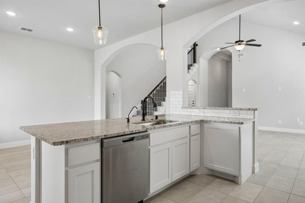 117 Joshua Tree Court Forney, TX 75126 - Photo 10 of 29 a kitchen with white cabinets and sink