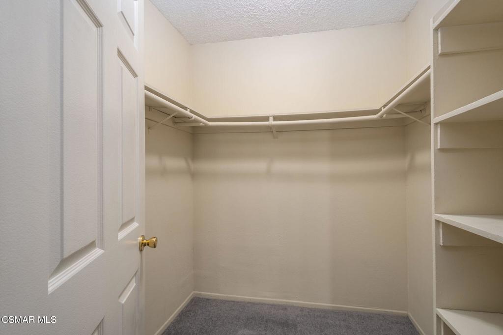 647 Arneill Road Camarillo, CA 93010 - Photo 14 of 27 a bathroom with a glass shower door