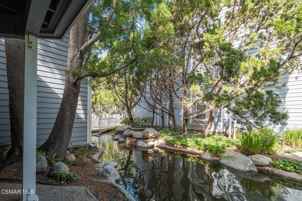 647 Arneill Road Camarillo, CA 93010 - Photo 21 of 27 a view of backyard with table and chairs and potted plants