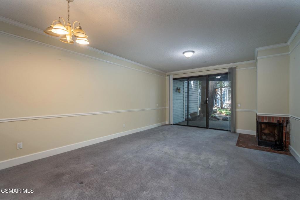 647 Arneill Road Camarillo, CA 93010 - Photo 5 of 27 an empty room with chandelier fan and windows