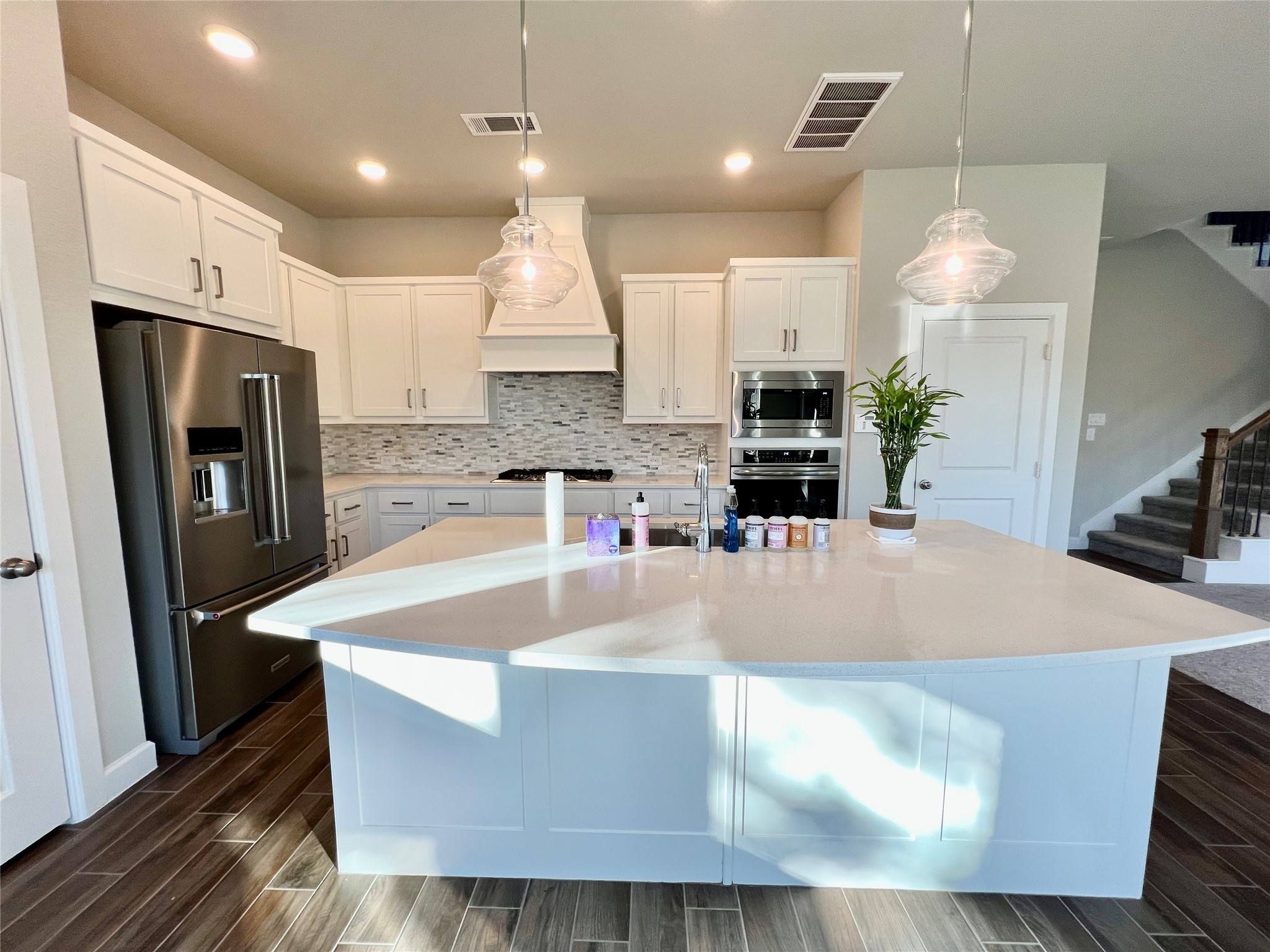 547 Kingston Lane Conroe, TX 77384 - Photo 13 of 50 a large kitchen with kitchen island a stove a sink a refrigerator and a refrigerator