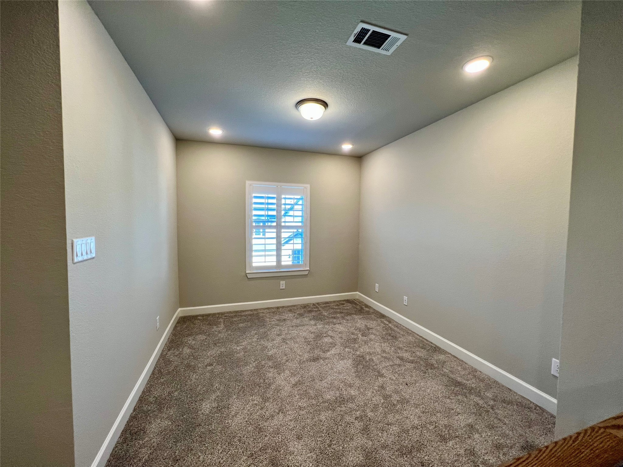 547 Kingston Lane Conroe, TX 77384 - Photo 36 of 50 an empty room with windows