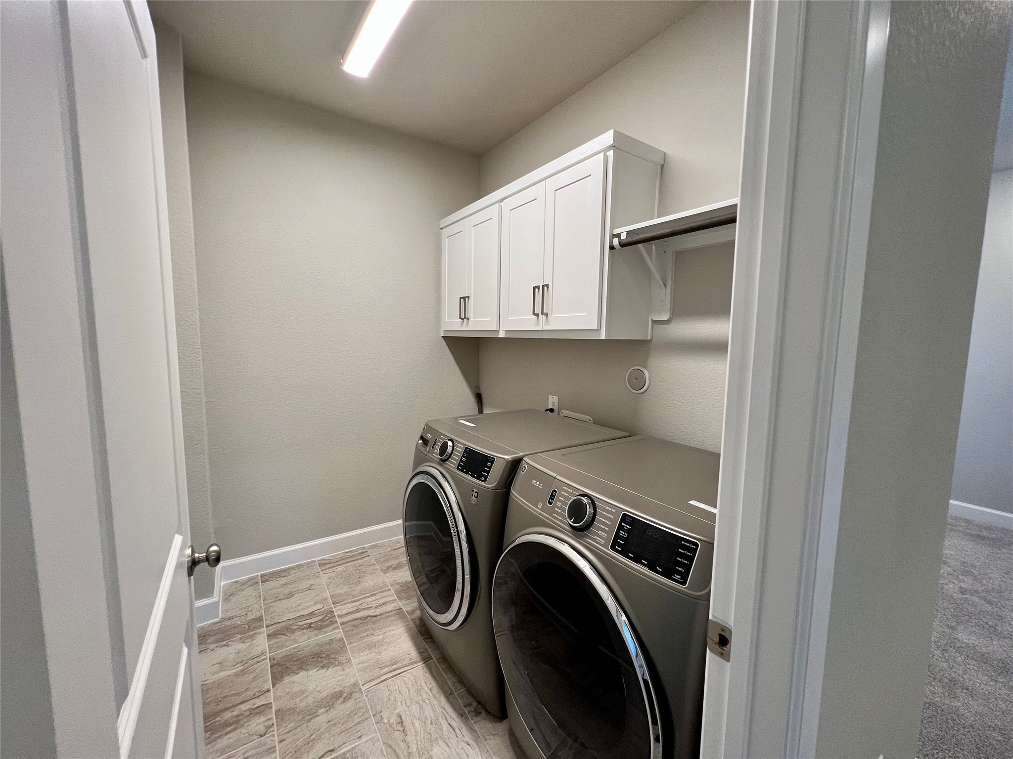 547 Kingston Lane Conroe, TX 77384 - Photo 37 of 50 a view of storage and utility room with washer and dryer
