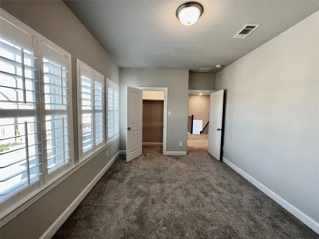 a bathroom with a double vanity sink toilet and shower