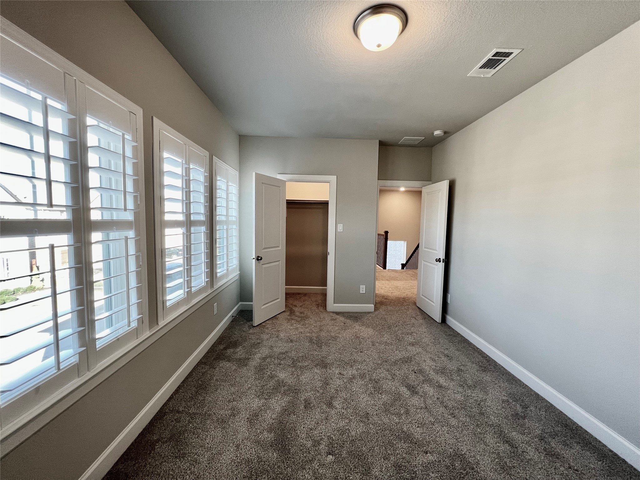547 Kingston Lane Conroe, TX 77384 - Photo 41 of 50 a view of empty room with a fireplace