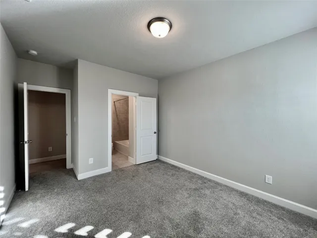 a white toilet sitting next to a bath tub