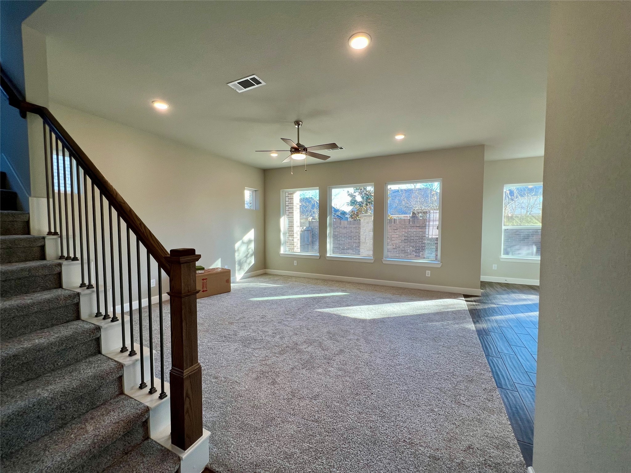 547 Kingston Lane Conroe, TX 77384 - Photo 5 of 50 en view interior of a house with stairs and windows