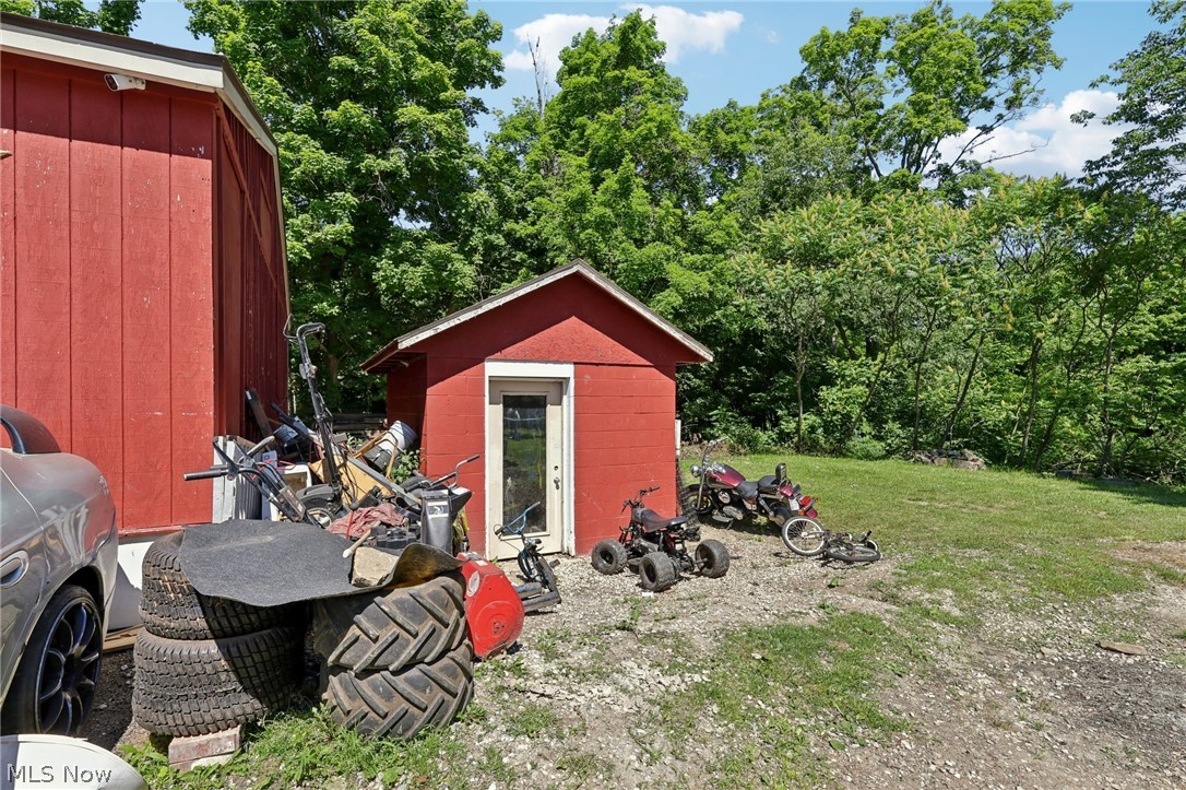 16146 Ravenna Road Burton, OH 44021 - Photo 27 of 27 View of yard featuring a storage unit