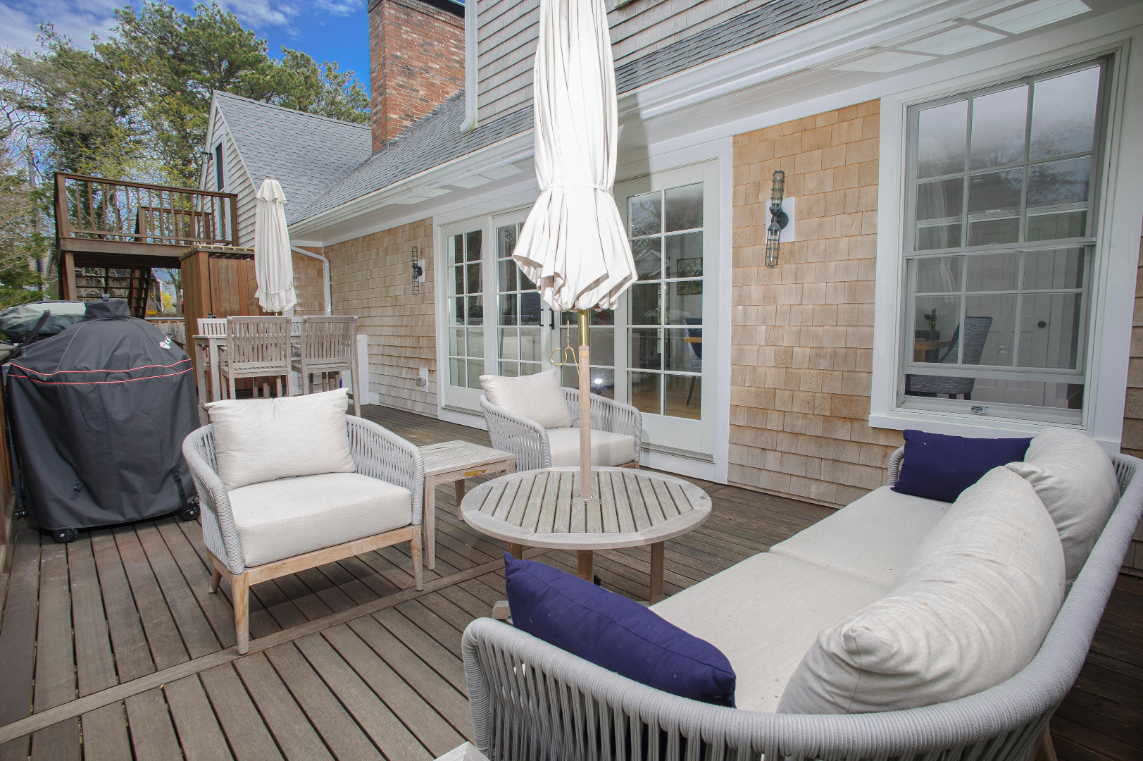 31 North Street Edgartown, MA 02539 - Photo 13 of 49 a view of a patio with couches chairs and wooden floor