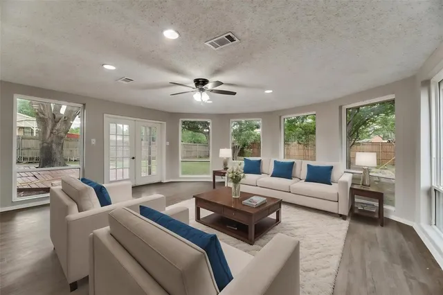 a living room with furniture and a large window