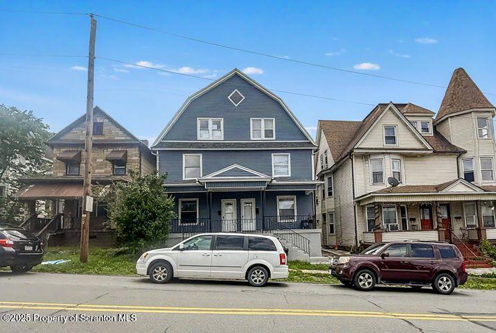 508 Harrison Avenue Scranton, PA 18510 - Photo 1 of 10 a front view of a residential apartment building with a yard