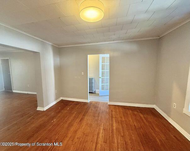 508 Harrison Avenue Scranton, PA 18510 - Photo 3 of 10 a view of an empty room with wooden floor and a window