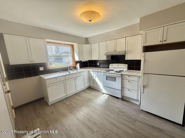 508 Harrison Avenue Scranton, PA 18510 - Photo 5 of 10 a kitchen with white cabinets and white appliances