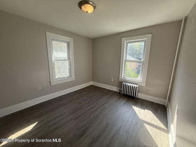 508 Harrison Avenue Scranton, PA 18510 - Photo 7 of 10 a view of an empty room with wooden floor and a window