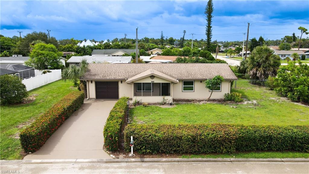 7233 Coolidge Road Fort Myers, FL 33967 - Photo 1 of 36 a aerial view of a house with a yard