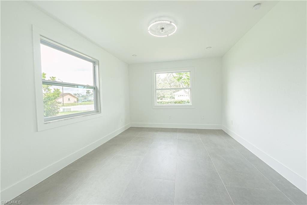 7233 Coolidge Road Fort Myers, FL 33967 - Photo 22 of 36 an empty room with windows
