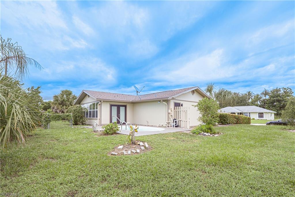 7233 Coolidge Road Fort Myers, FL 33967 - Photo 28 of 36 a front view of house with yard and green space