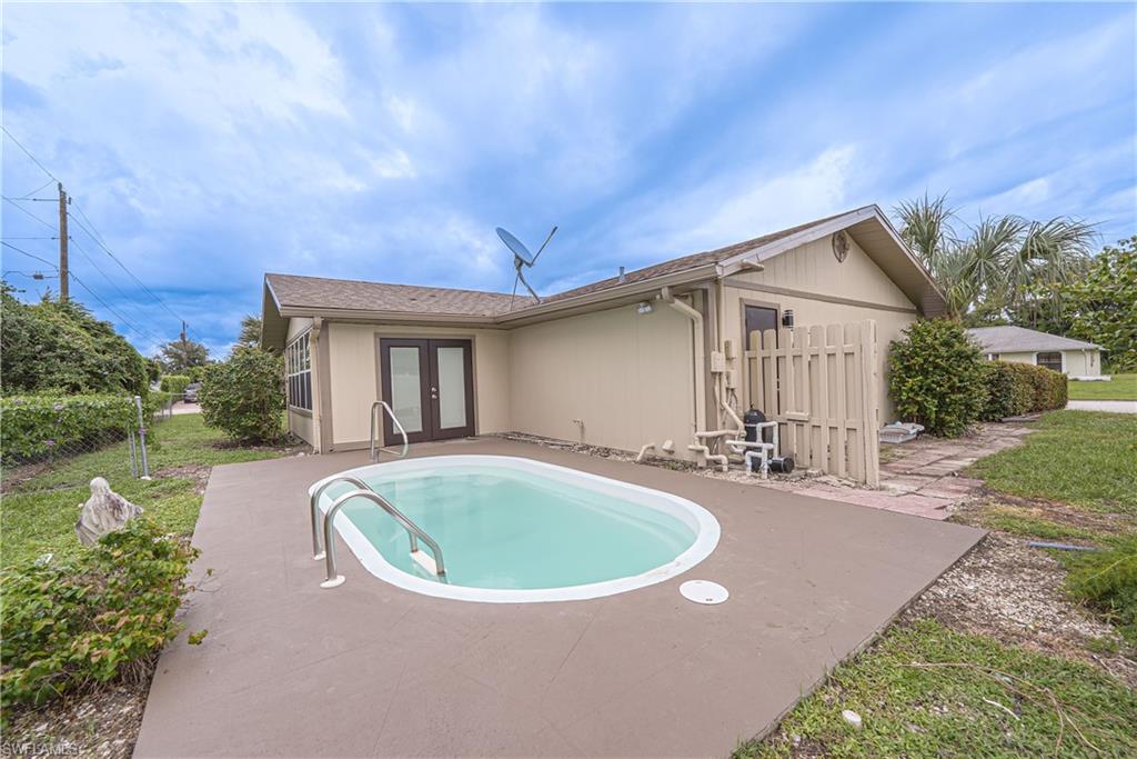 7233 Coolidge Road Fort Myers, FL 33967 - Photo 30 of 36 a view of house with swimming pool and yard