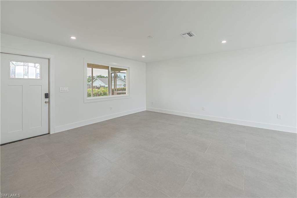 7233 Coolidge Road Fort Myers, FL 33967 - Photo 7 of 36 an empty room with windows