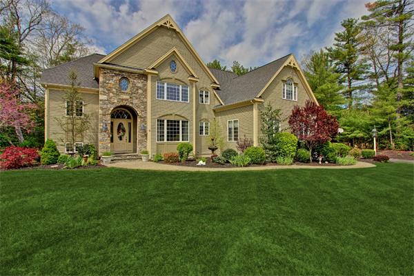 a front view of a house with a yard