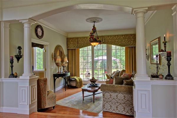 9 Riverbend Road Upton, MA 01568 - Photo 12 of 30 a living room with furniture a flat screen tv and a large window