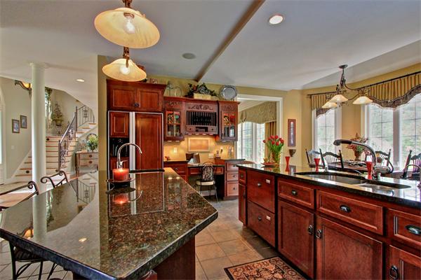 9 Riverbend Road Upton, MA 01568 - Photo 19 of 30 a kitchen with stainless steel appliances granite countertop a sink and cabinets
