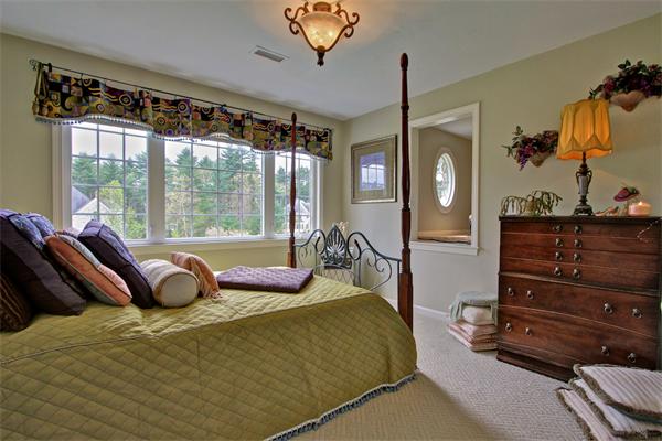9 Riverbend Road Upton, MA 01568 - Photo 27 of 30 a bedroom with a bed and window
