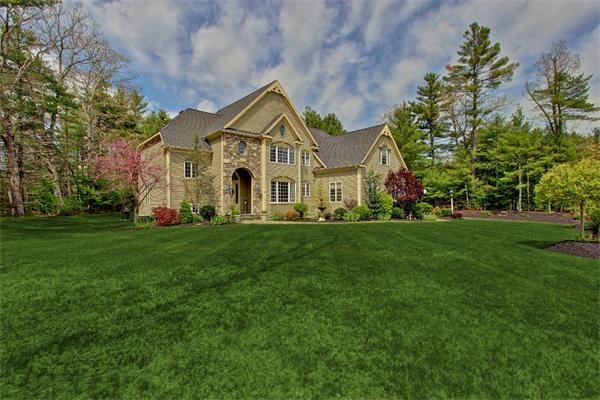 9 Riverbend Road Upton, MA 01568 - Photo 3 of 30 a front view of a house with a yard