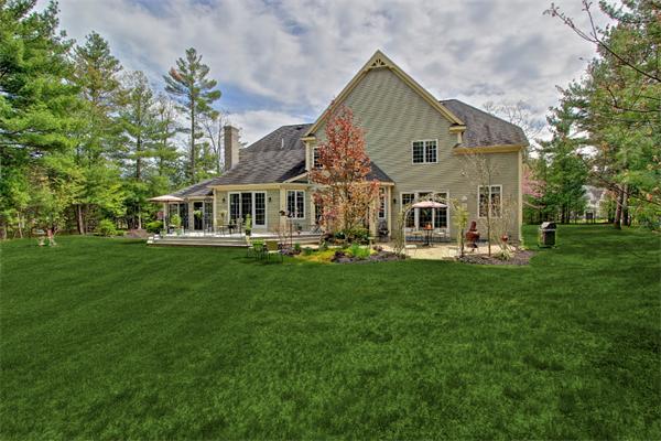 9 Riverbend Road Upton, MA 01568 - Photo 5 of 30 a front view of a house with a yard