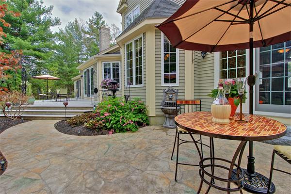 9 Riverbend Road Upton, MA 01568 - Photo 7 of 30 a backyard of a house with yard and outdoor seating