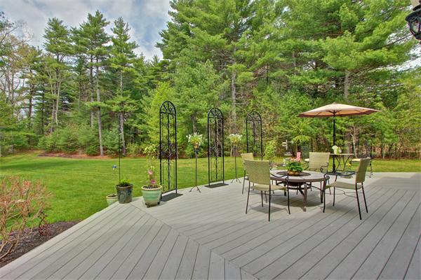 9 Riverbend Road Upton, MA 01568 - Photo 8 of 30 a view of a table and chairs in patio with a garden