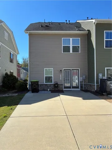an empty room with wooden floor and entrance