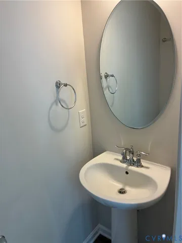 a white toilet sitting in a bathroom