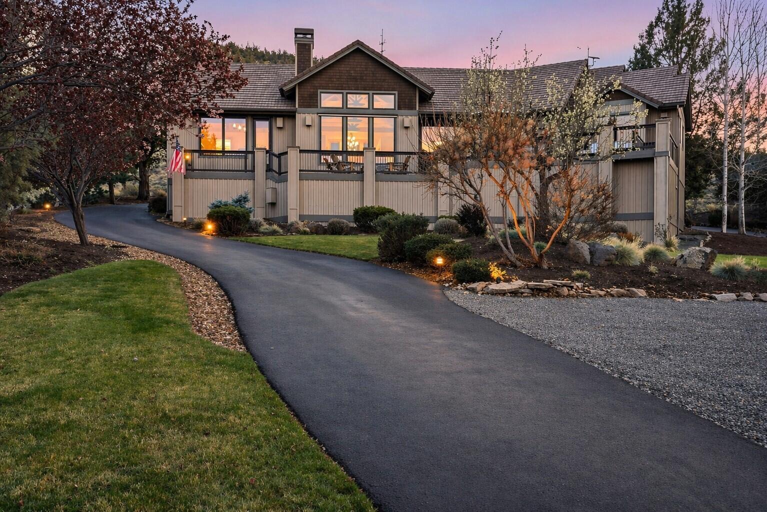 631 Sundance Ridge Court Redmond, OR 97756 - Photo 1 of 61 a front view of a house with a garden and a yard