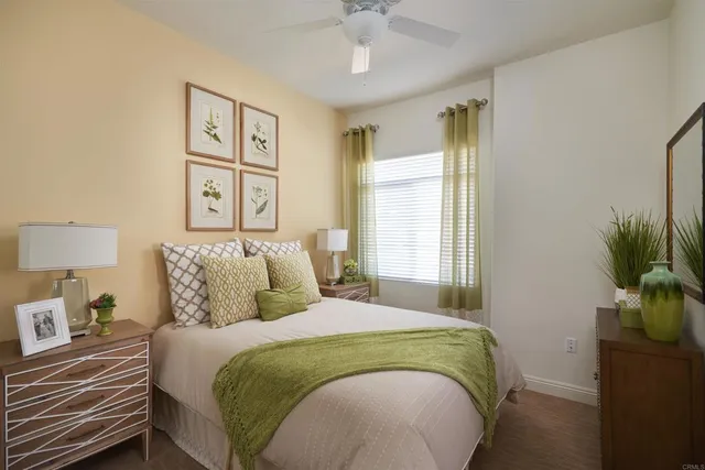 a bedroom with a bed and a window