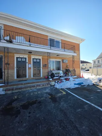 a view of a house with backyard porch and sitting area