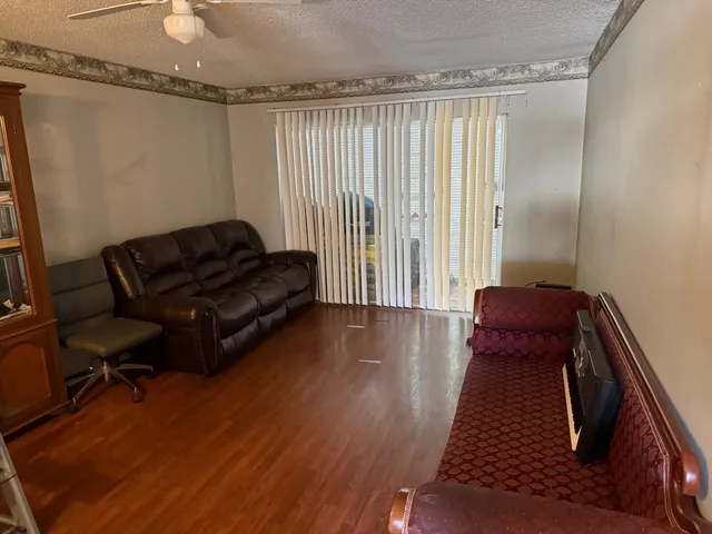 a bed sitting in a room next to a window