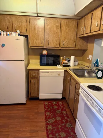 a view of a living room area and bedroom