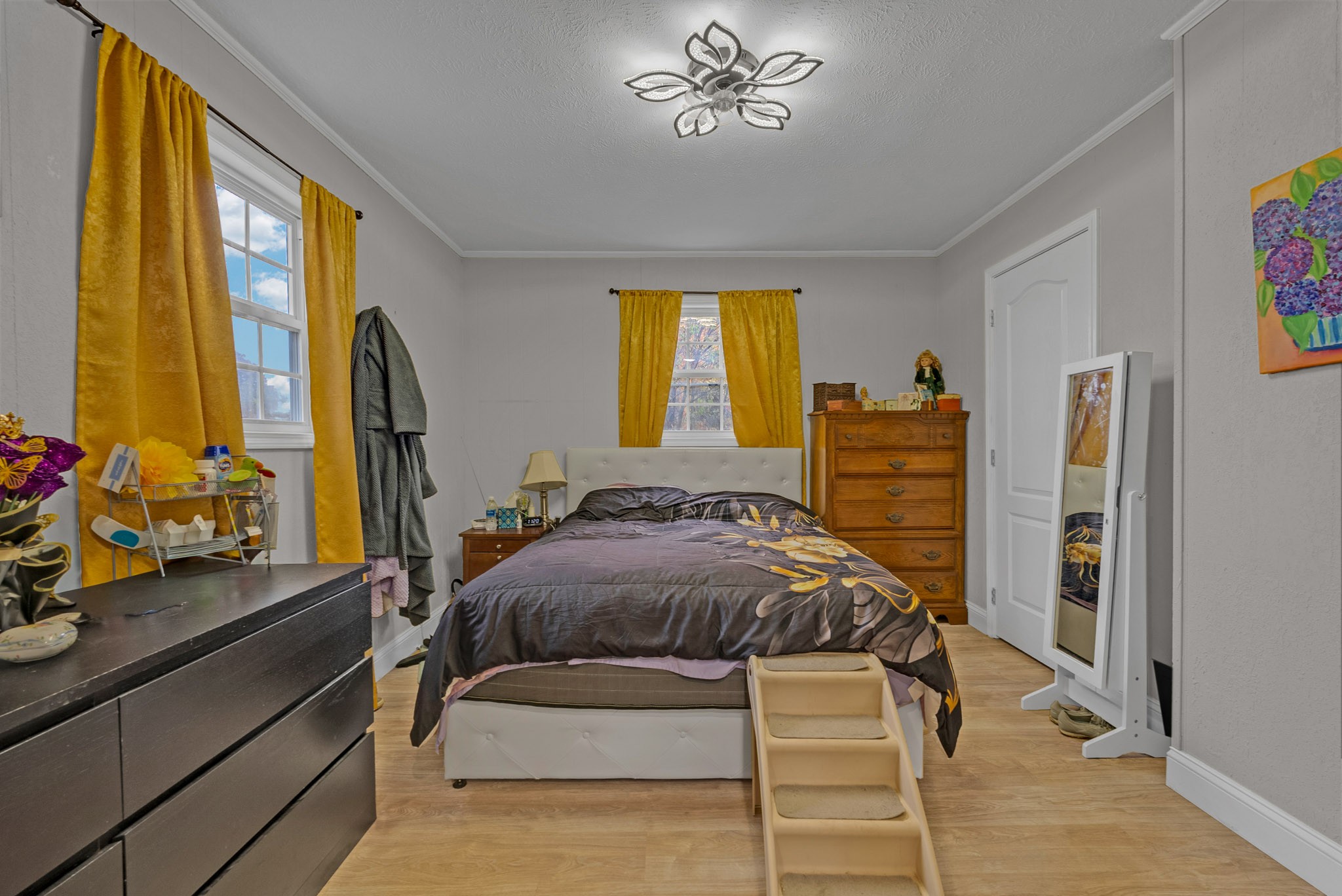921 Barney Holt Road Jamestown, TN 38556 - Photo 12 of 24 a bedroom with a bed and a dresser