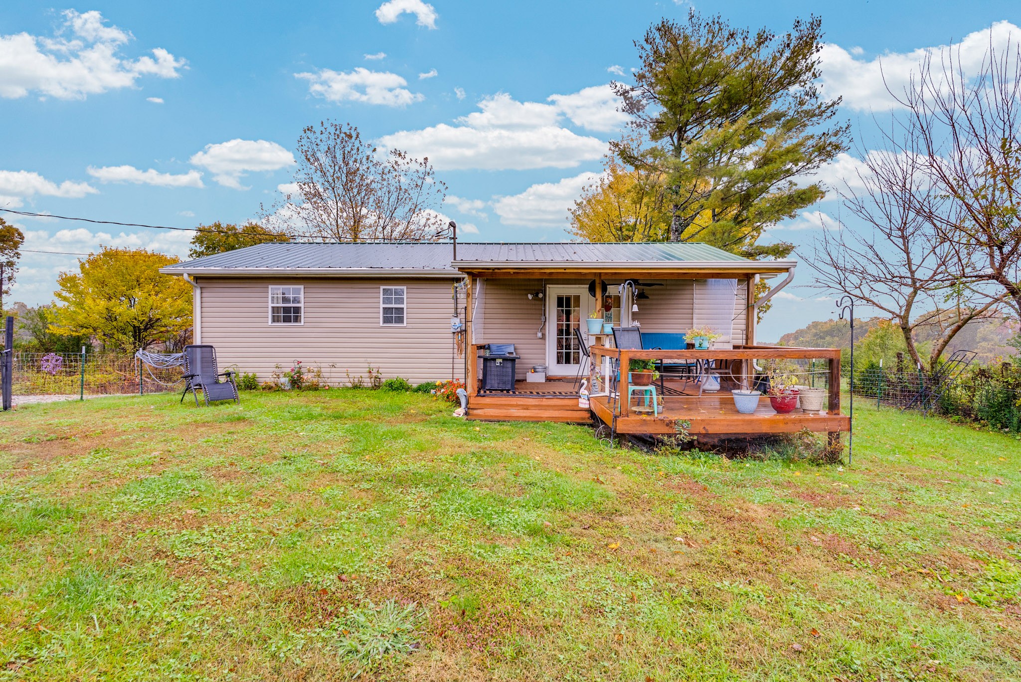 921 Barney Holt Road Jamestown, TN 38556 - Photo 21 of 24 a view of a house with backyard porch and furniture