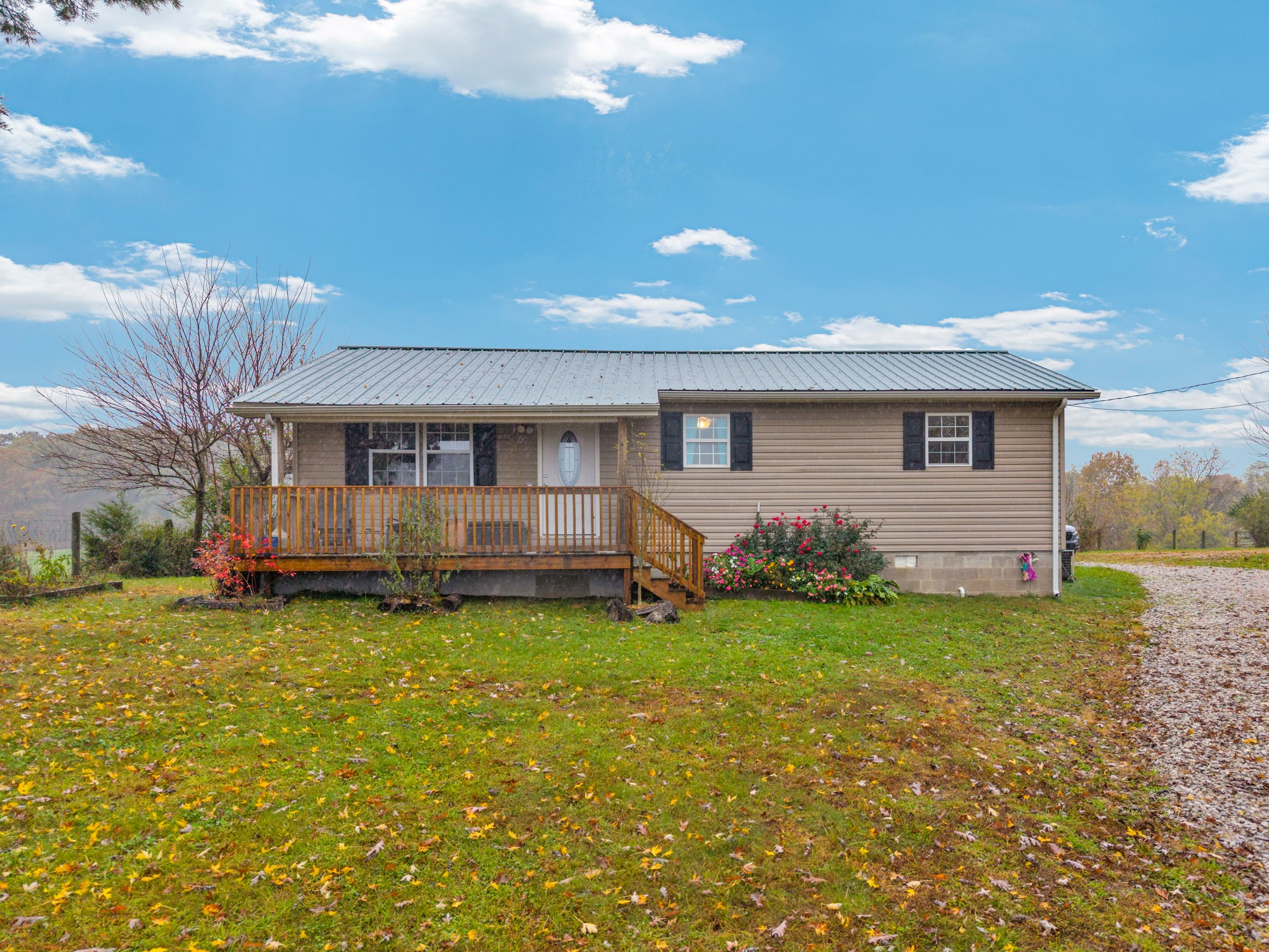 921 Barney Holt Road Jamestown, TN 38556 - Photo 24 of 24 a view of a house with a yard and sitting area