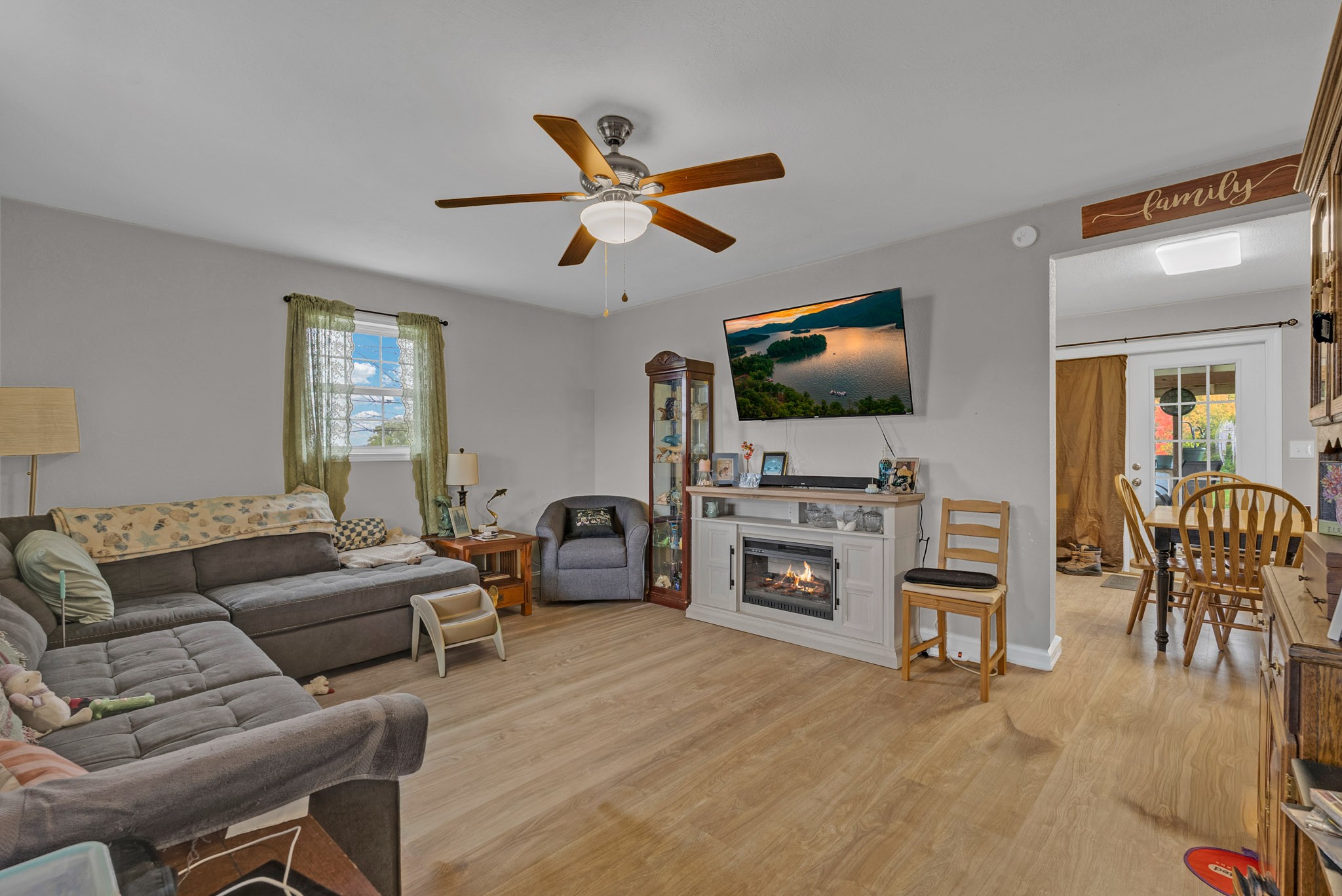 921 Barney Holt Road Jamestown, TN 38556 - Photo 7 of 24 a living room with furniture and a flat screen tv