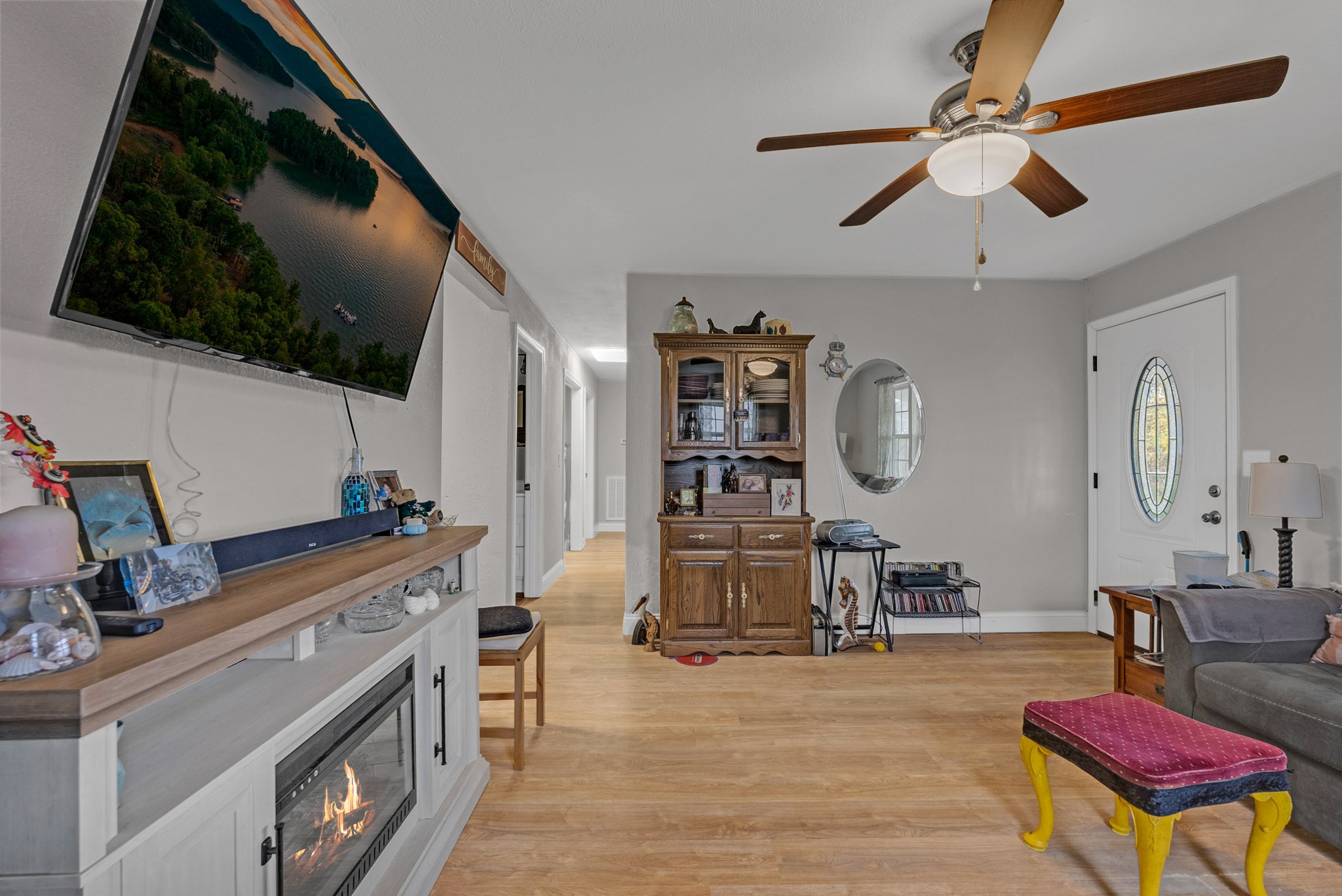 921 Barney Holt Road Jamestown, TN 38556 - Photo 8 of 24 a living room with furniture and a flat screen tv