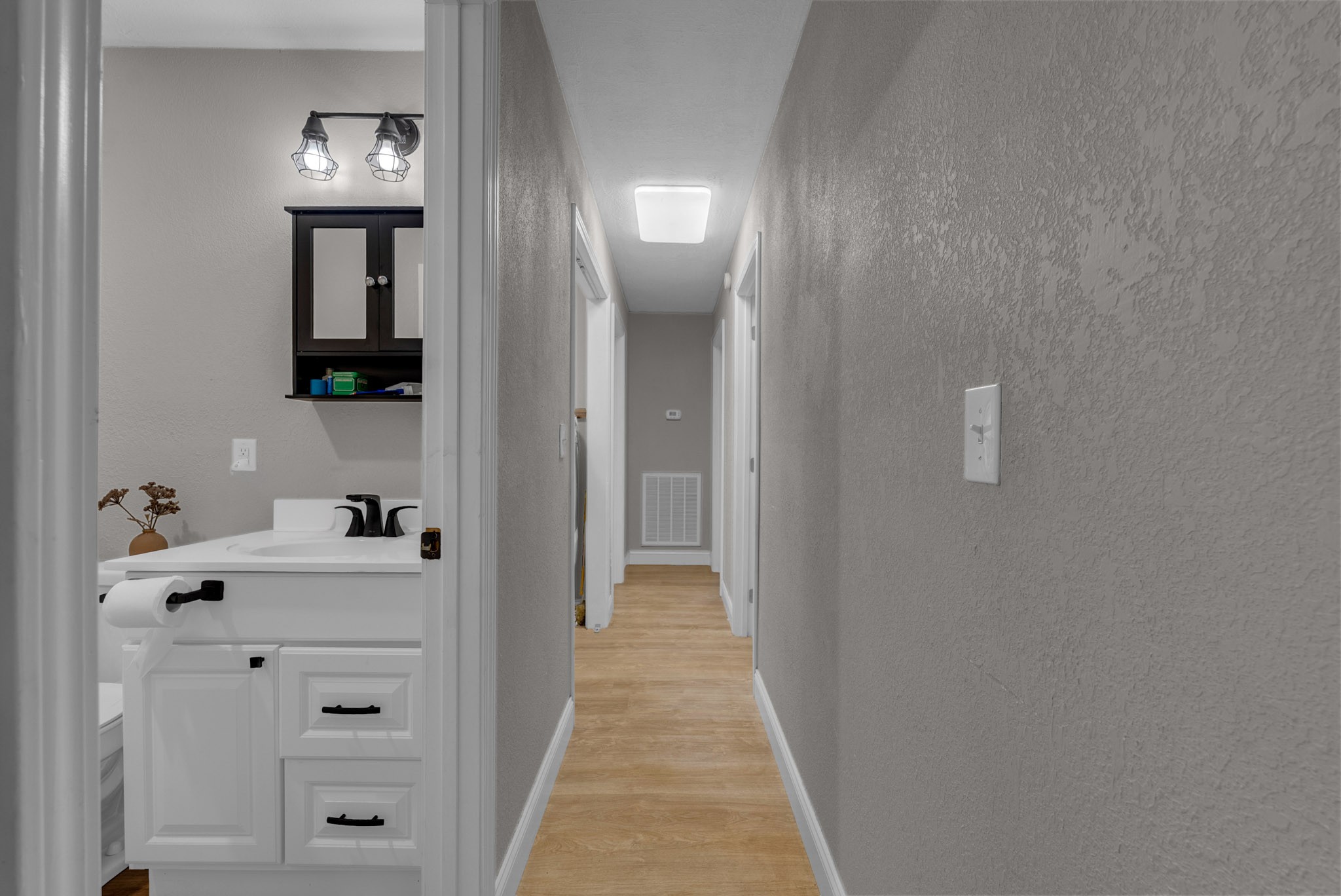 921 Barney Holt Road Jamestown, TN 38556 - Photo 9 of 24 view of a hallway with wooden floor and closet