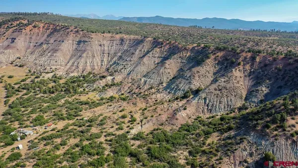 a view of mountain view with mountains in the background