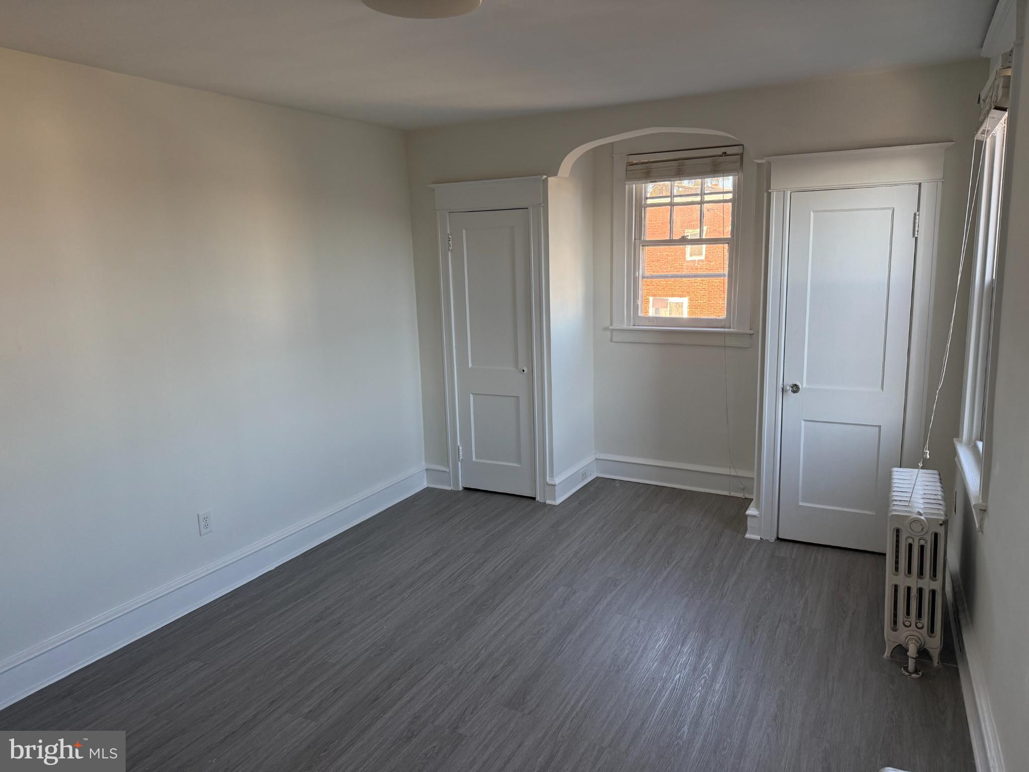 7735 Loretto Avenue Philadelphia, PA 19111 - Photo 13 of 19 an empty room with wooden floor and a window